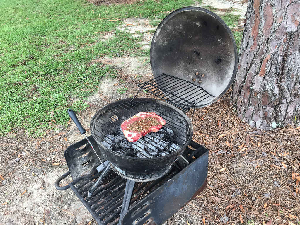 Grilling steak on the grill
