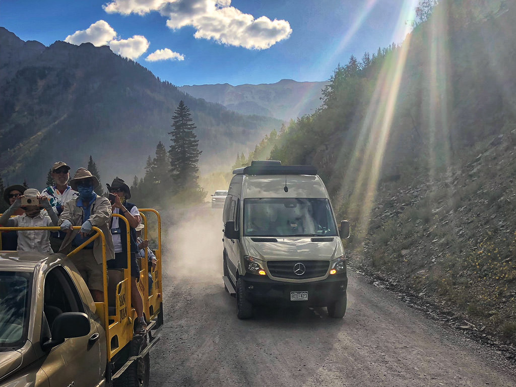 WinnieBs on Jeep tour being passes by a Winnebago Revel.