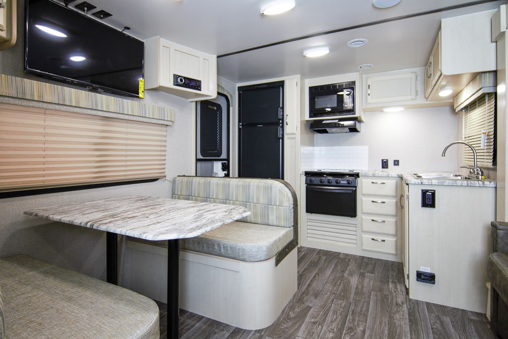 Dinette and kitchen of Winnebago Minnie Travel Trailer.