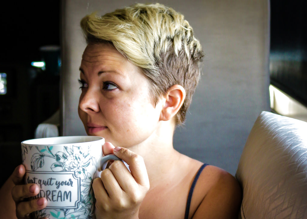 Jess drinking from a coffee cup