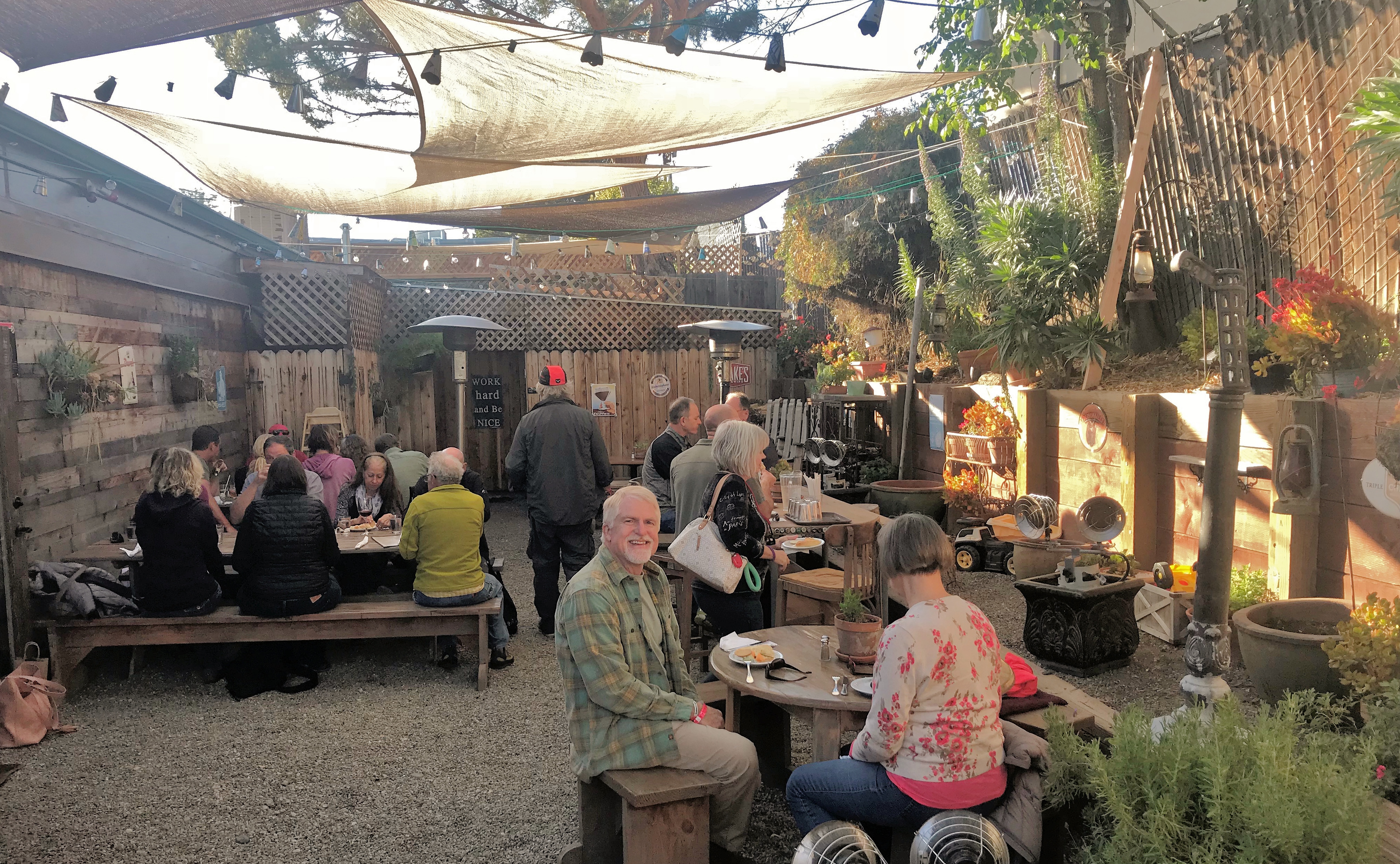 Attendees eating dinner outside at a restaurant