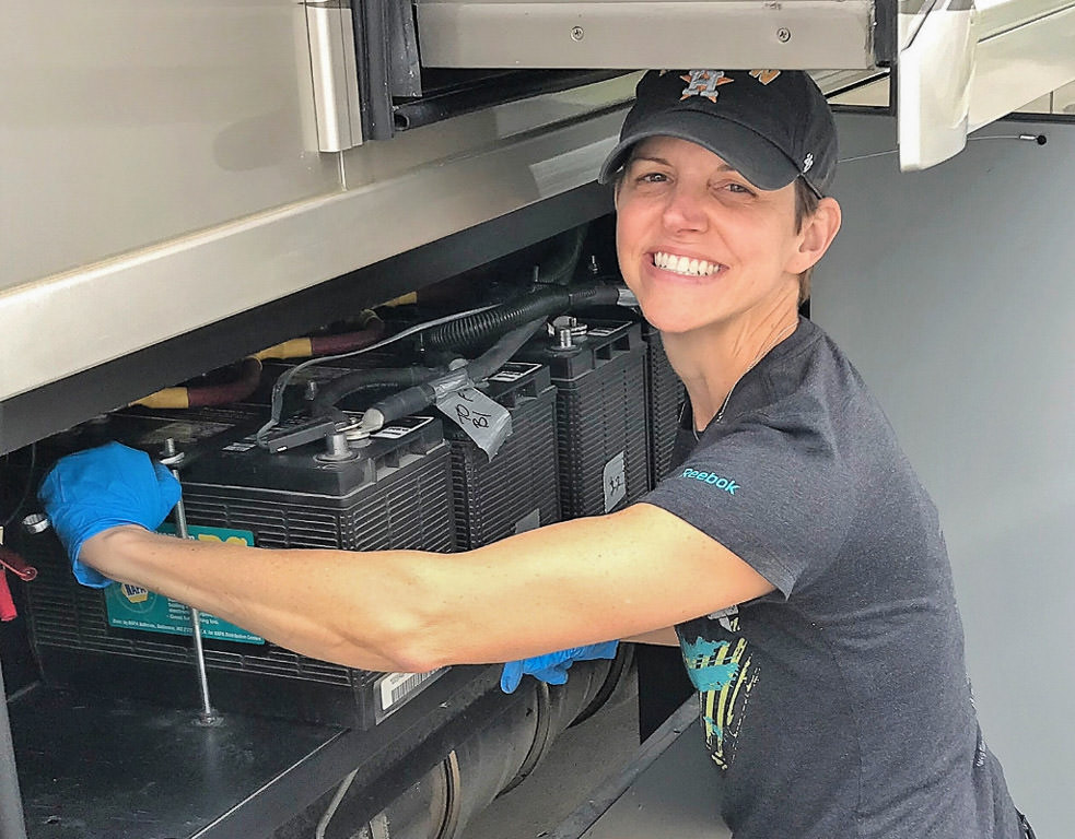 Ann adding water to house batteries