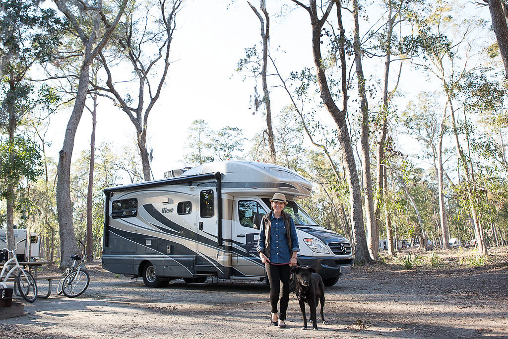Brittany standing with dog in front of View