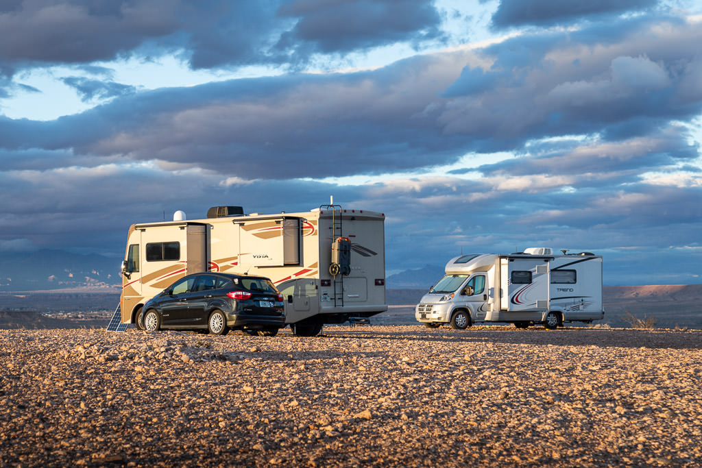 Vista and Trend parked in gravel lot
