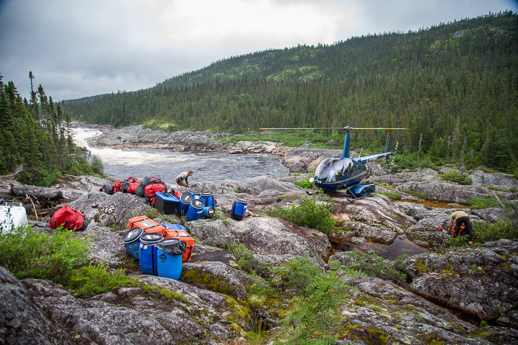 Helicopter picking up the boats and supplies.