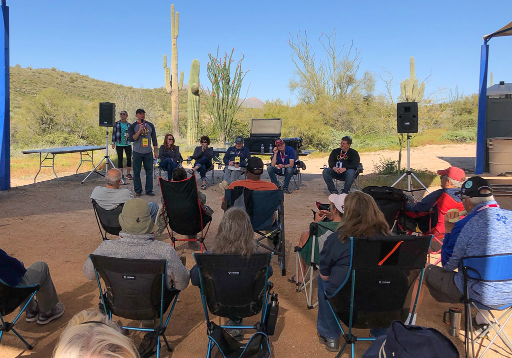 Group gathered listening to a speaker. 