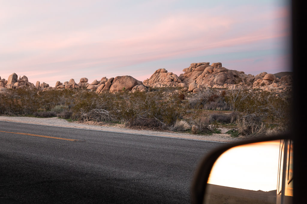 Rock formation with edge of mirror in view.