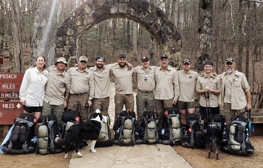 Warrior Expeditions participants outside of trailhead