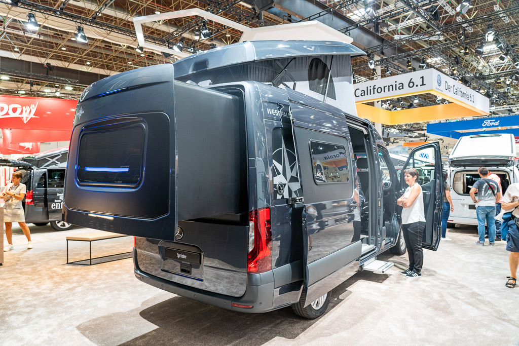 Campervan with pop-top and a rear slideout.