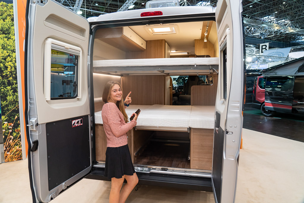 Bunkbeds at the back end of an RV.